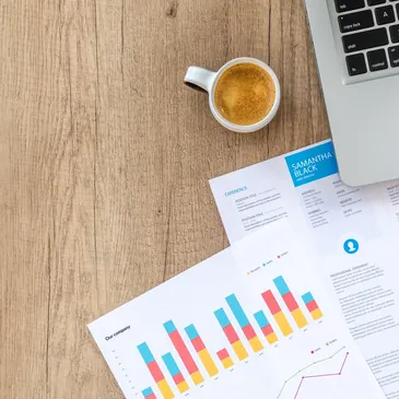Printed reports and charts on a desk